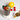 Glass mug with hot beverage, lemon, and berries on a white surface with a bowl of tea leaves and honeycomb.