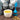 Tea cup with blue tea infuser and chicory root on a wooden surface