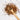 Wooden spoon of Organic Cold Remedy loose leaf tea on a white background.