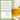 Glass of iced tea with tea leaves and water dropper on a light background