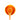 Wooden spoon of Orange Essential Oil on a white background.