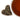 Heart-shaped dish with dried tea leaves next to a cup of brewed tea on a white background