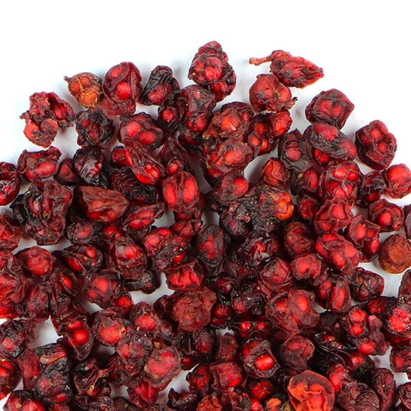 Dried Schisandra berries on a white background