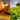Split image showing ground turmeric on the left and green tea leaves on the right.