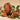 Chaga mushroom with green leaves on a beige background