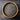Wooden bowl filled with chia seeds on a wooden surface