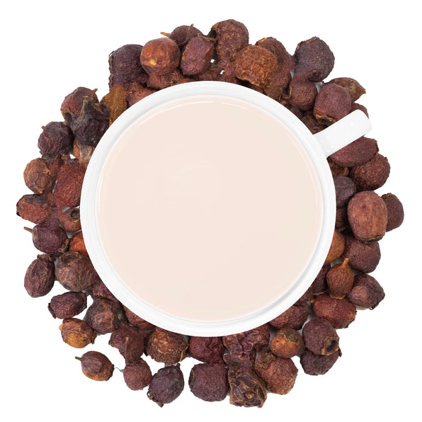 A cup of Organic Hawthorn Berry tea is centered with dried hawthorn berries scattered around it, providing a visual representation of the product.