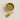 Wooden bowl and scoop filled with green leaves on a beige background