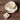 Teacup with saucer, spoon, and slippery elm in a bowl on a wooden surface