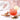 A glass of iced Organic Sugar Crush Tea with a slice of lemon, surrounded by wooden spoons of loose leaf tea, hibiscus petals, and cinnamon sticks, with a soft heart-shaped decoration in the background.