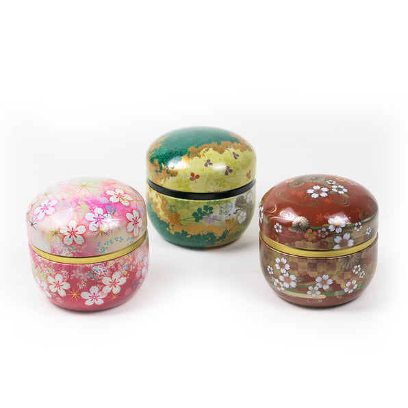 Three Decorative Japanese Matcha Tins. Cherry Blossom Pink, Gilded Green, and Floral Red.