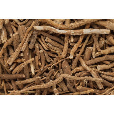A close up picture of a pile of ashwagandha root with a white border. 