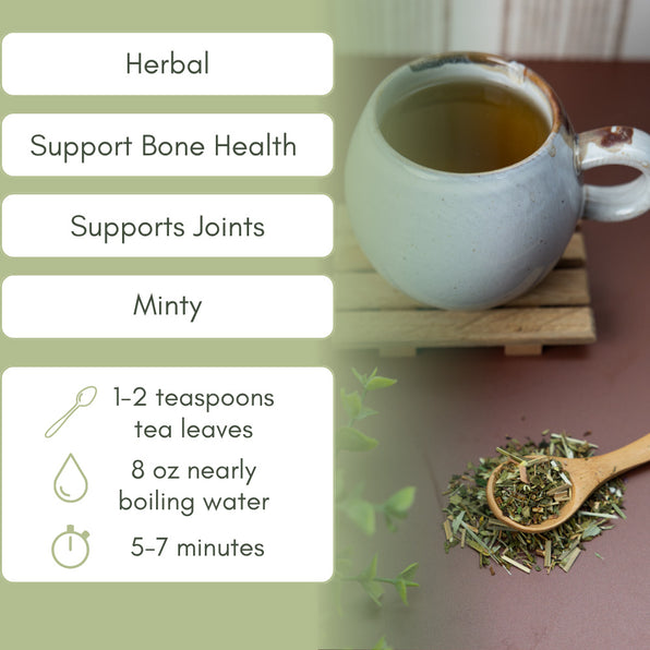 Tea cup with bone health herbs and brewing instructions on a green background