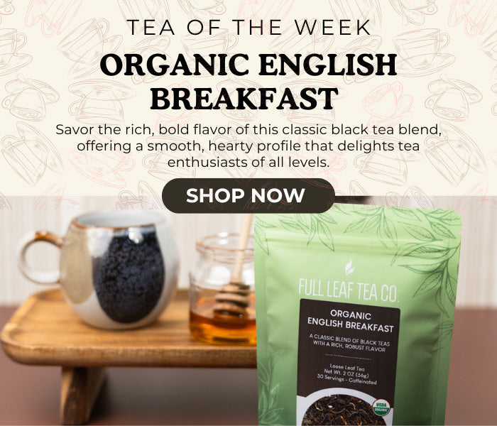 Promotional image for Organic English Breakfast tea from Full Leaf Tea Co. with a tea bag and cup on a wooden stand.