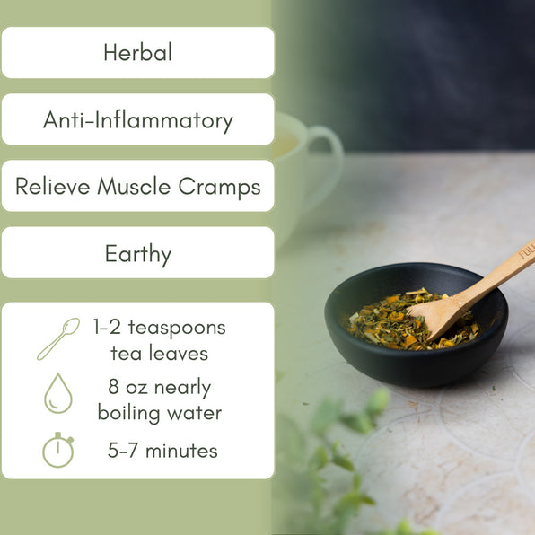 Tea cup with muscle cramp herbs and brewing instructions on a wooden surface
