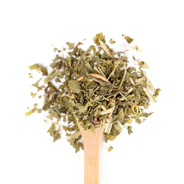 Wooden spoon of Organic Passion Flower on a white background.