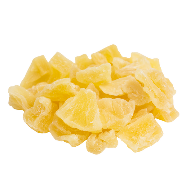 Dried pineapple chunks on a white background