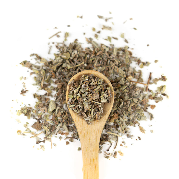 Wooden spoon of Organic Sage on a white background.