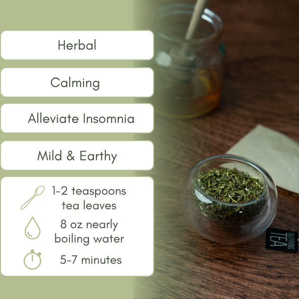 Glass bowl with dried skullcap herbs on a wooden surface, labeled for herbal tea preparation.