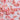 Scattered pink rose petals on a soft pink background creating a delicate, romantic texture.