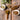 Spices and herbs on wooden spoons and bowls on a rustic wooden surface