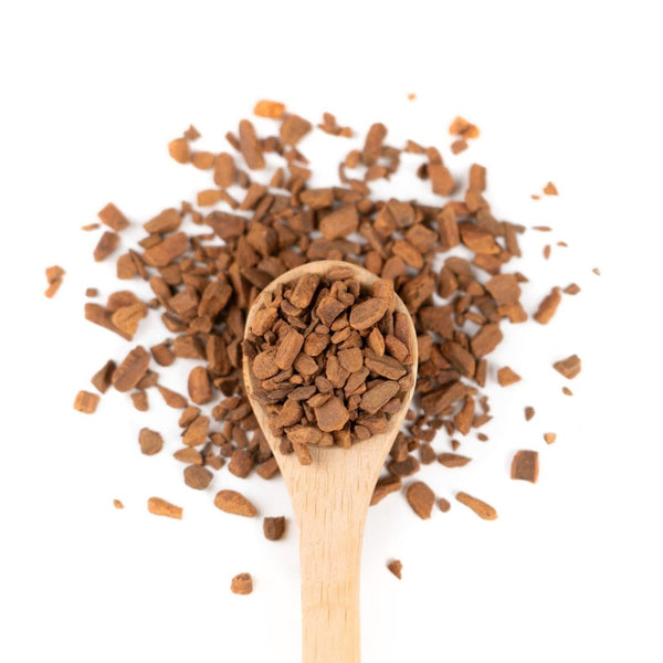 Organic Cinnamon on a wooden spoon.