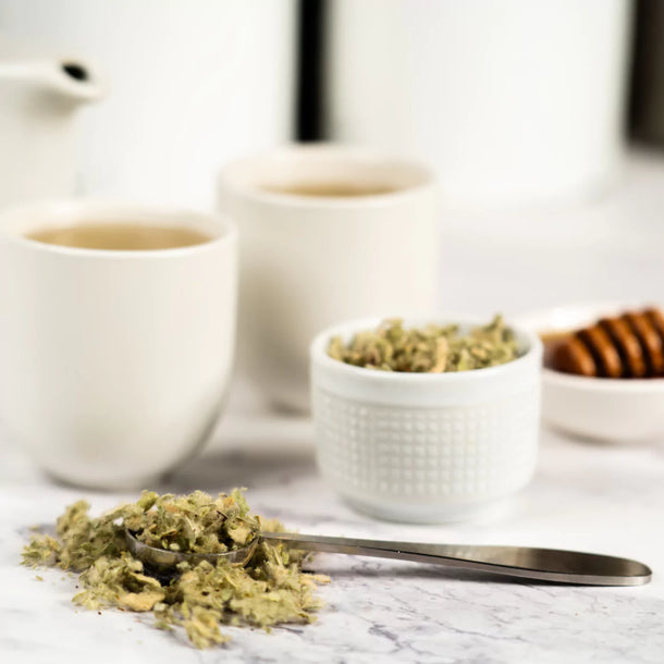 Mullein loose leaf sitting on table in dishes as well as spoon