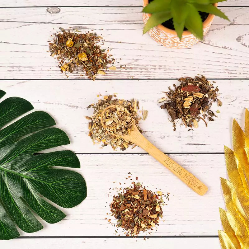 Loose leaf tea ingredients strewn across table