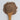 Wooden spoon filled with Rhodiola powder on a white background